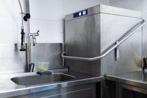 sink and dishwasher in commercial kitchen