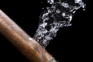 water leaks out of cracked copper water line